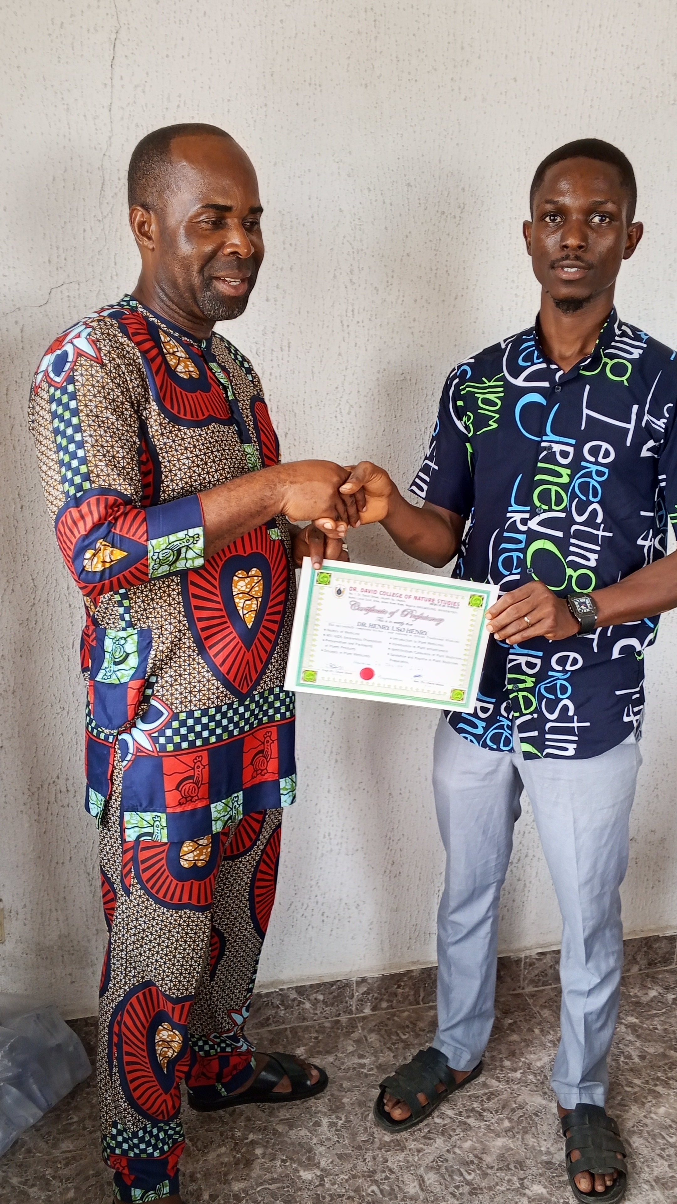 Student receiving certification from DDCNS