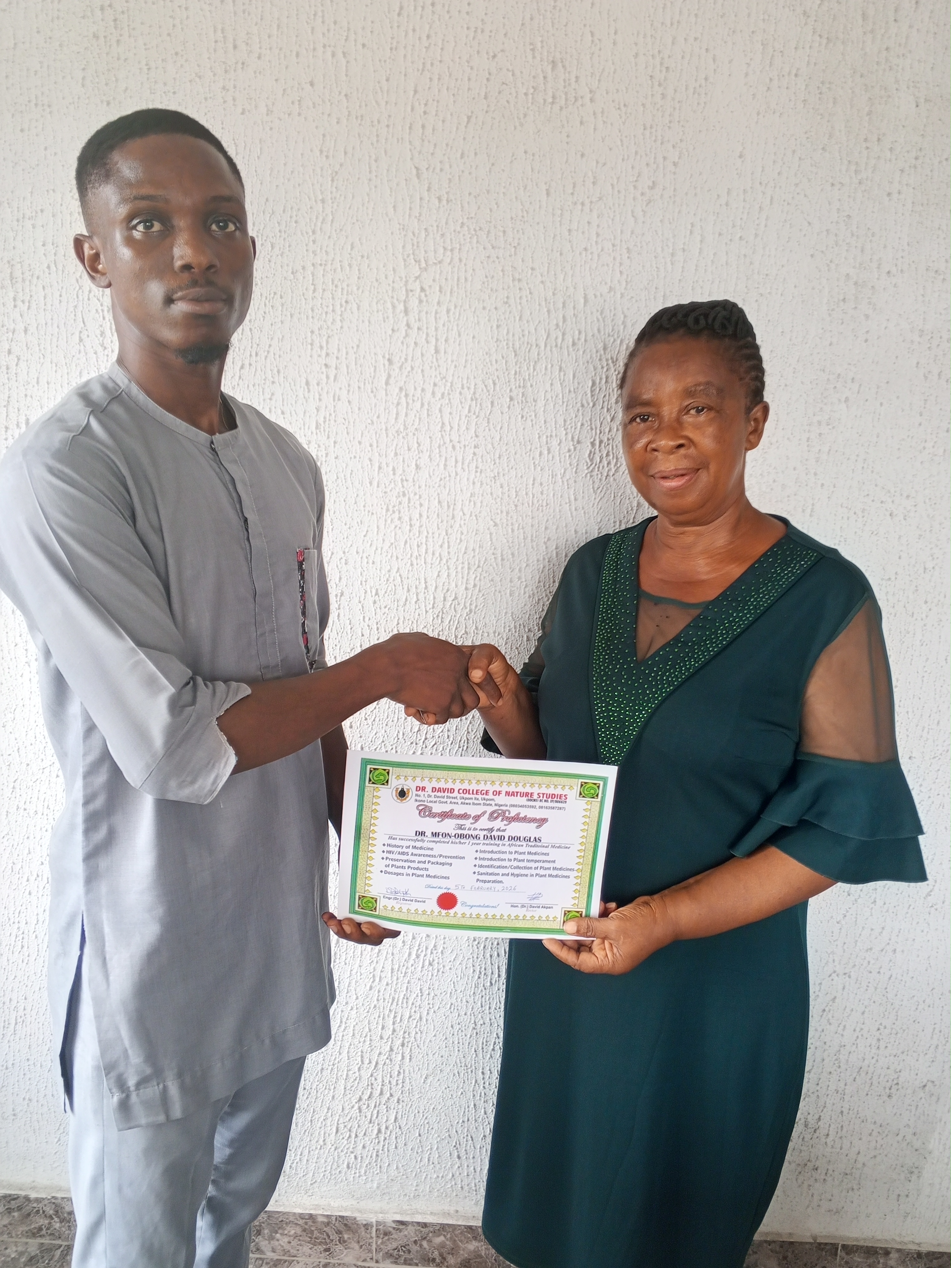 Student receiving certification from DDCNS