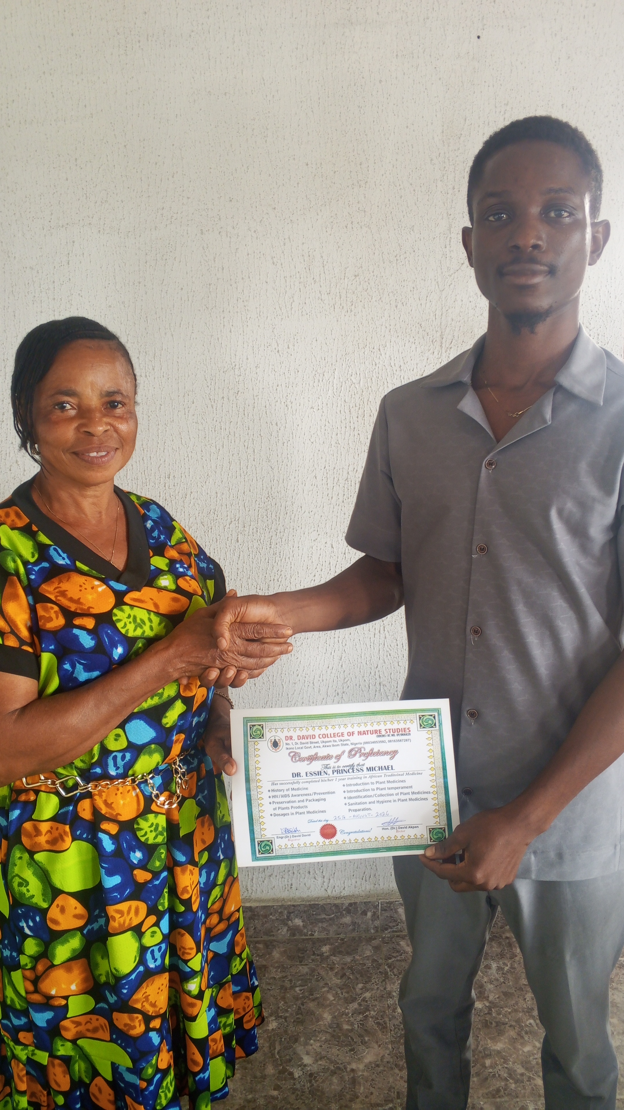 Student receiving certification from DDCNS